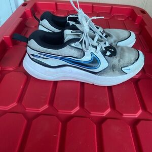 Nike White and Black Sneakers with Blue Swoosh Accent